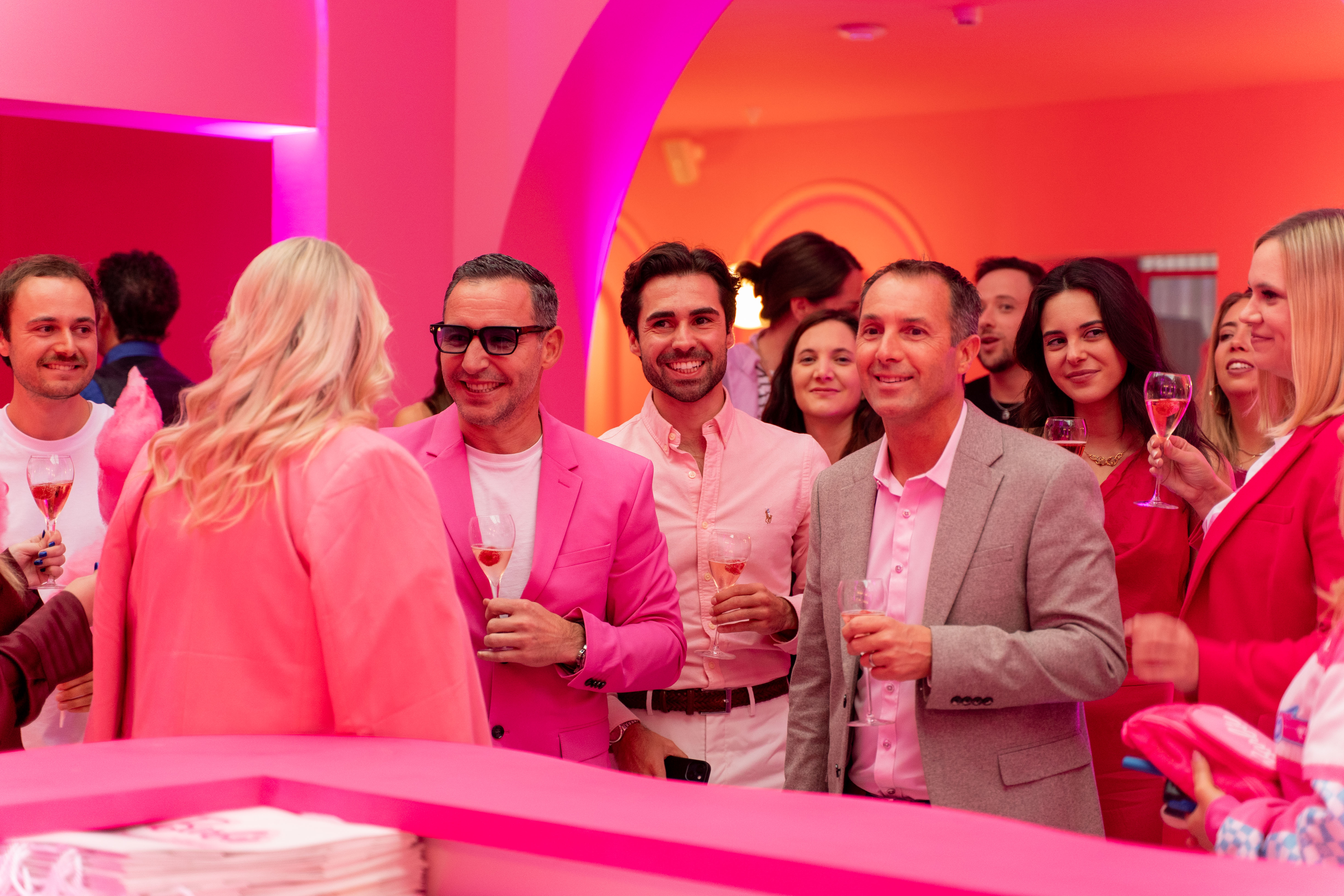 group-of-people-dressed-in-pink-standing-in-barbie-experience-museum