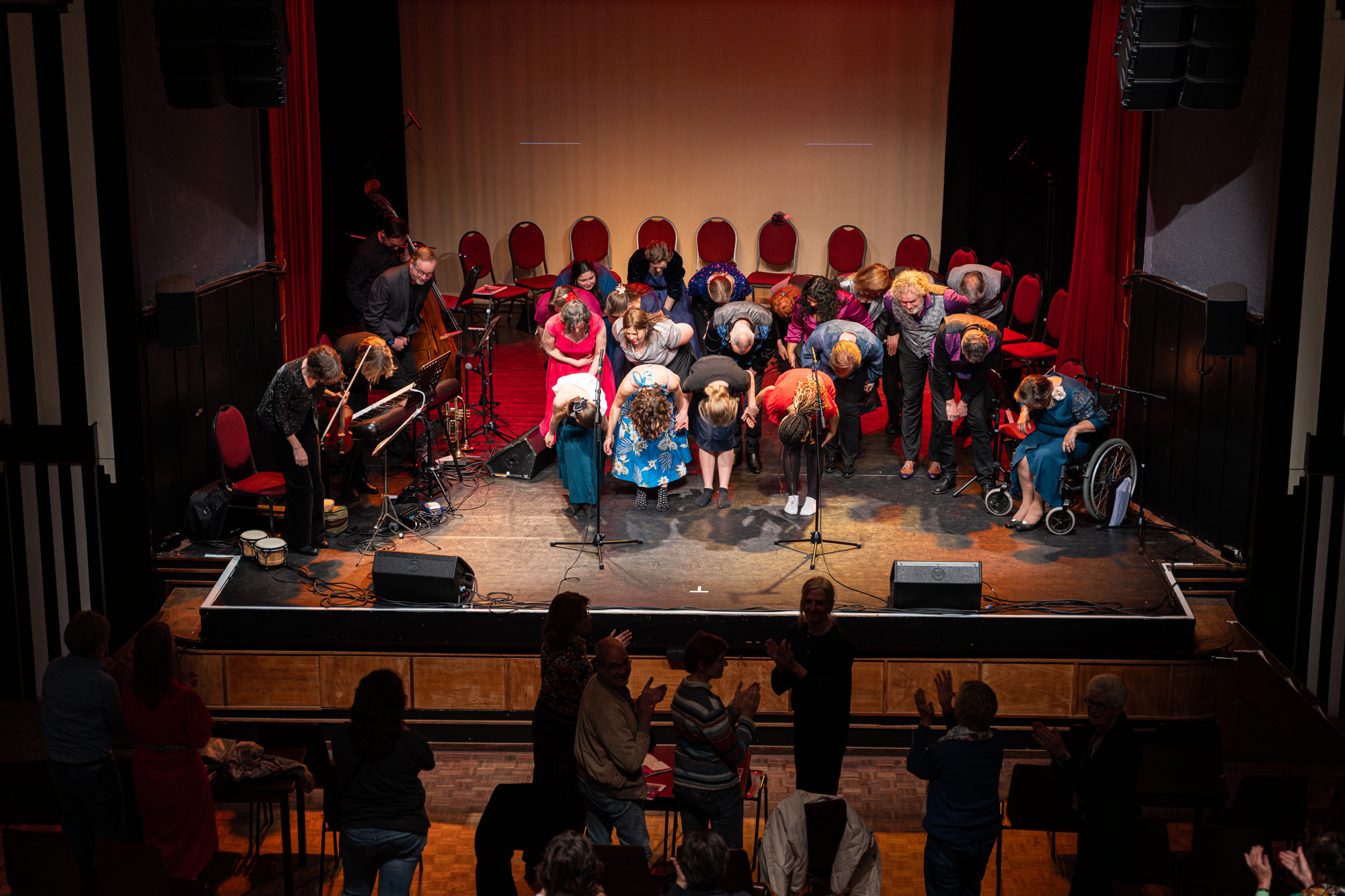 Theatre performance view from balcony actors bowing