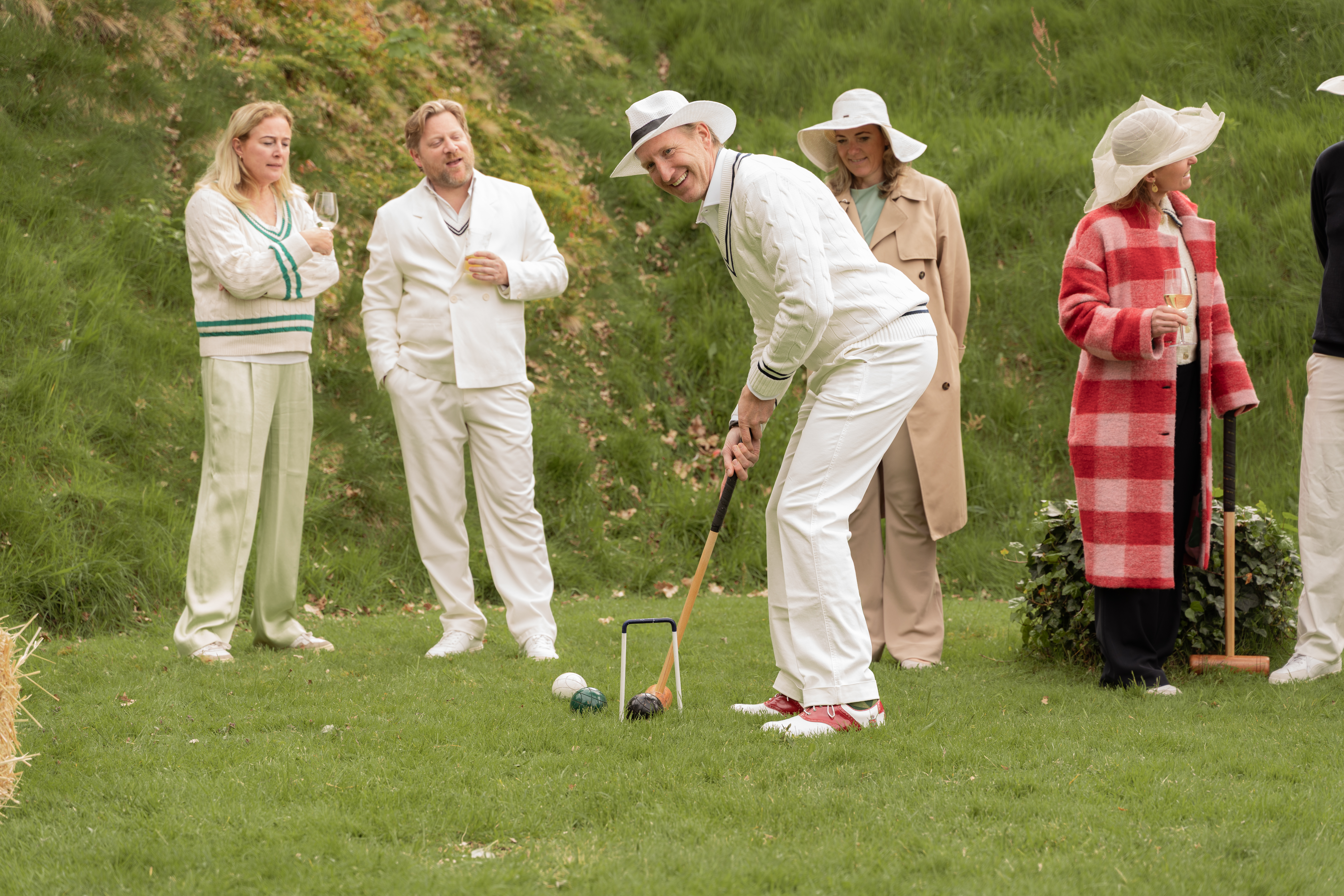 Man playing croquet game