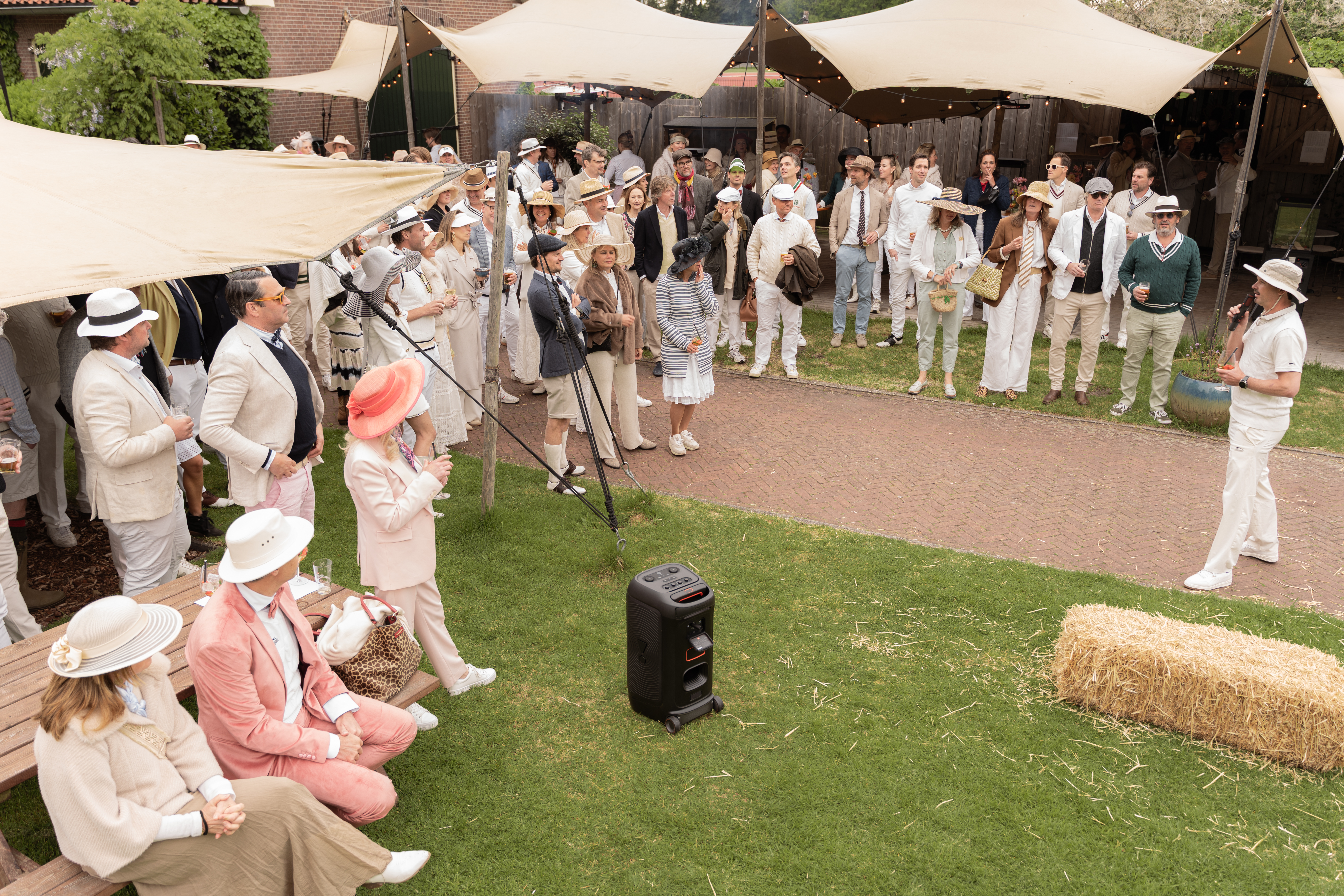 Group of Croquet players listening to speaker