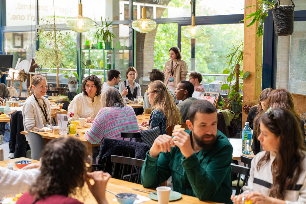 Networking during breakfast at a bright cafe
