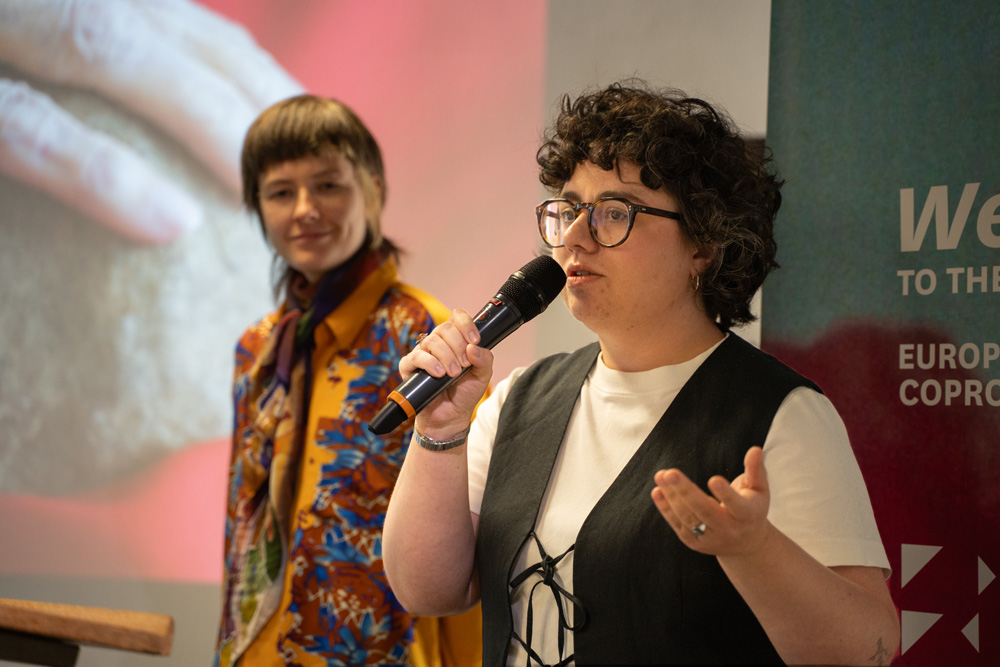 Person giving a presentation holding a microphone
